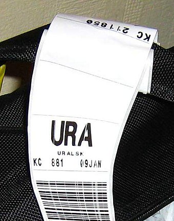 A baggage tag for a flight heading to Oral Ak Zhol Airport, whose IATA airport code is "URA".