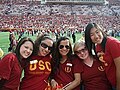 The Helenes arrive hours early to football games to help decorate the student section of the stadium