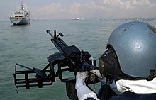 Close in defence aboard RSS Resilience US Navy 040526-N-7906B-107 A Republic of Singapore Navy (RSN) gunner assigned to the patrol vessel RSS Resilience, keeps his sight trained on the Military Sealift Command (MSC) combat stores ship USNS Concord (T-AFS 5).jpg