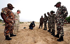 US Navy 110426-F-XM360-035 Chief Explosive Ordnance Technician Justin Berlien, second left, observes Namibia Defense Forces (NDF) EOD and Namibian.jpg