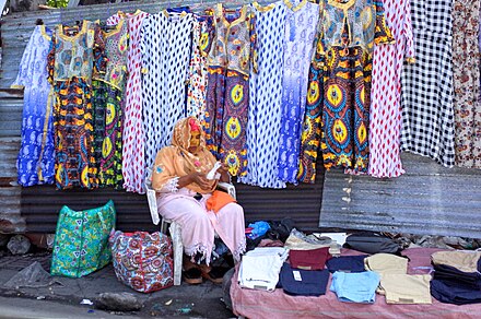 Women selling colourful dresses in Volo Volo market