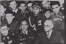 Ze'ev Jabotinsky (bottom right) meeting with Betar leaders in Warsaw. Bottom left Menachem Begin (probably 1939). ZEEV JABOTINSKY (BOTTOM R) MEETING WITH BETAR LEADERS IN WARSAW. BOTTOM LEFT MENAHEM BEGIN. zAb z'bvtynsqy npgSH `m mnhygy byt"r bvrSHh, pvlyn. mSHmAl lmD705-081.jpg