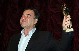Oliver Stone with Golden Alexander in hand