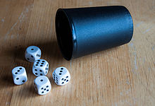 Each player has five dice and a dice cup 160327 White dice 11.jpg