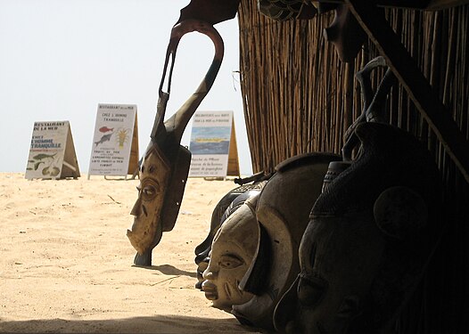 Artisan masks facing the sea