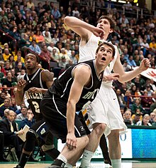 Butler's Andrew Smith and Siena's Ryan Rossiter both try to anticipate the rebound, as Butler's Shawn Vanzant closes in from behind. Photo taken November 23, 2010.