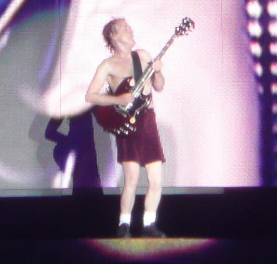 Young during a performance of "Let There Be Rock"