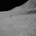 Vesicular boulder at Station 4 on the rim of Dune Crater. North-western slope of Mt. Hadley in the background