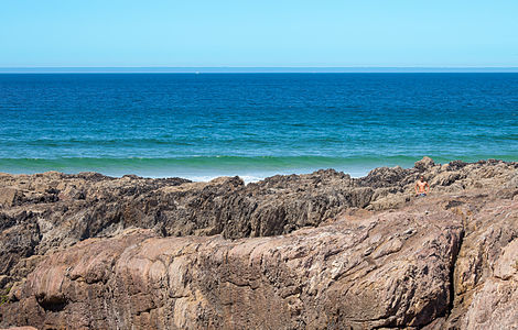 Swimmer looking at camera on the beach of As Furnas. Porto do Son. Galicia (Spain).