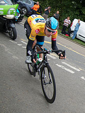 Wiggins wearing the leader's jersey at the 2013 Tour of Britain Bradley Wiggins - Tour of Britain 2013 (cropped).jpg