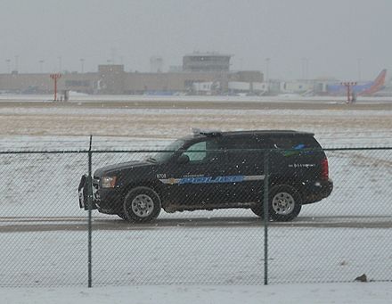 A Cleveland Hopkins International Airport Police officer patrols the airport perimeter in a Chevy Tahoe Police Cruiser.