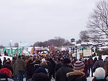 A crowd at the Place de la Famille, a Quebec Winter Carnival site on the Plains of Abraham Carnaval de Quebec - place de la famille - 2006-02.JPG