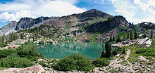 Cecret Lake, headwater of Little Cottonwood Creek Cecret Lake Panorama Albion Basin Alta Utah July 2009.jpg