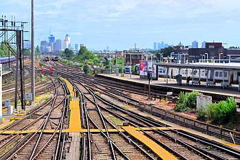 The complex mass of train tracks through Clapham Junction, UK as an analogy of the complex society its infrastructure supports.