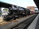 Preserved Danish steam locomotive DSB PR 908 with restored train in Odense in 2006