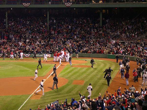 Boston Red Sox designated hitter David Ortiz jumps onto home plate after winning Game 4 of the 2004 American League Championship Series at Fenway Park