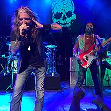 John Corabi and Marco Mendoza of The Dead Daisies performing at College Street Music Hall in New Haven, Connecticut, 2015 DeadDaisiesLive.JPG