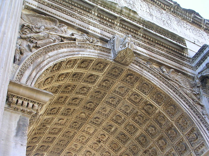 The elaborate carvings and coffered vault of the Arch of Septimius Severus