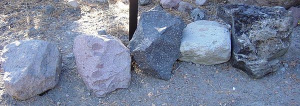 Grey, red, black, altered white/tan, flow-banded pumice dacite