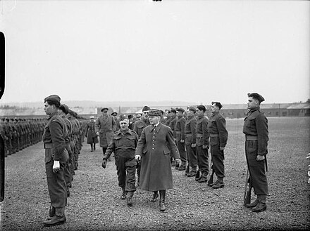 General Maurice Gamelin, Commander−in-Chief (C-in-C) of the French Army, reviews Canadian troops at Aldershot, May 1940. Stood behind him is Major-General Andrew McNaughton.