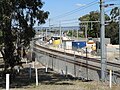 Construction work north-east of the station. The tunnel portal for the future Forrestfield-Airport railway line is visible in the distance. View from Railway Parade east of Bassendean Road.