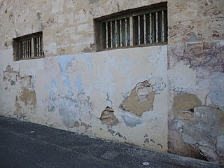 Two Division yard wall, with faded/damaged artwork