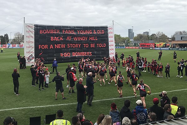 Essendon players take the field prior to its AFLW match against St Kilda; the match marked Essendon's first top-level match at its spiritual home sinc