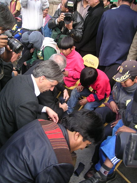Morales and Vice President Álvaro García Linera in 2006 shining the shoes of shoeshine boys.