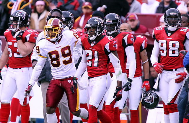 Quarterback Michael Vick of the Atlanta Falcons drops back to pass against  the Dallas Cowboys at the Georgia Dome on De…