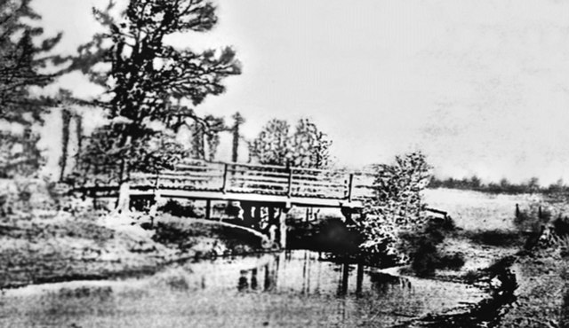 First bridge over Cane Island Creek, circa 1895