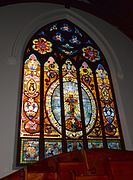 Large window in rear wall of sanctuary
