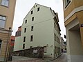 Residential house in closed development and in a corner, with side wing to the courtyard