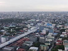 Stage 3 under construction above G. Araneta Avenue in Quezon City (2018) G. Araneta Avenue (C3 Road) cor. E. Rodriguez, Skyway Stage 3 construction, sunset (Quezon City)(2018-05-12).jpg