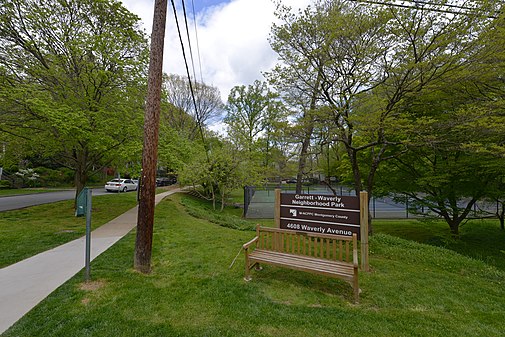 The a bench and the sign for Garrett-Waverly Neighborhood Park, Garrett Park, MD