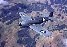 The Bearcat was heavily influenced by the larger F6F Hellcat. Grumman F6F-3 Hellcat of VF-1 in flight over California (USA), in 1943 (80-G-K-605).jpg