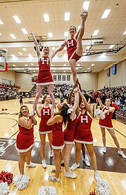 Cheerleaders at a basketball game. Harvard cheerleaders at men's basketball.jpg