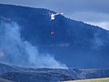 Helicopters Otago ZK-HJK BK 117 B-2, coming in to land while fighting the Mt Allan forest fire near Dunedin in New Zealand