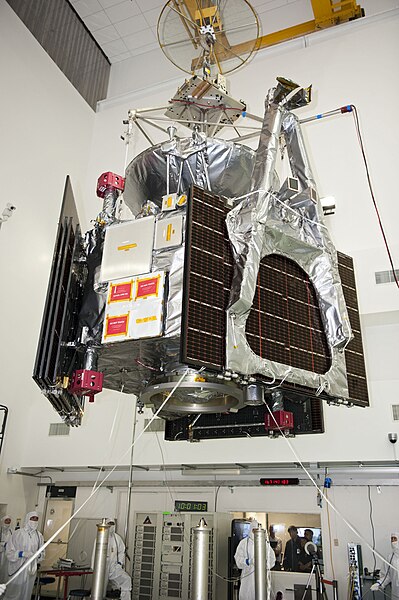 In this view several white squares of different sizes can be seen on the side of the spacecraft;this side has five of the six MWR antennas. The triang