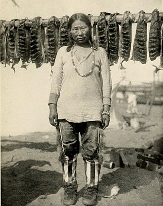 Kow-Ear-Nuk and salmon catch, early 1900s Kow-Ear-Nuk and his drying salmon.jpg