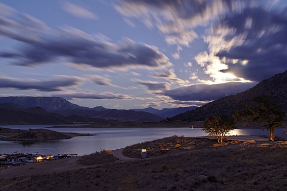 The full moon rises over Lake Isabella reservoir, shown at 16% of capacity after long drought