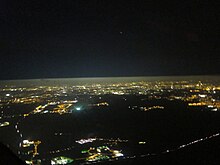 The difference in the amount of aerosols below and above the boundary layer is easy to see in this aerial photograph. Light pollution from the city of Berlin is strongly scattered below the layer, but above the layer it mostly propagates out into space. Light pollution and the planetary boundary layer over Berlin.jpg