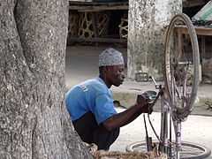 Man Repairing Bicycle - Bagamoyo - Tanzania.jpg