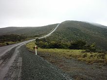 The former metal road (actually State Highway 1) to Cape Reinga in 2005, sealing being finished in 2010. 'Metal road' is a local term for a gravel road.