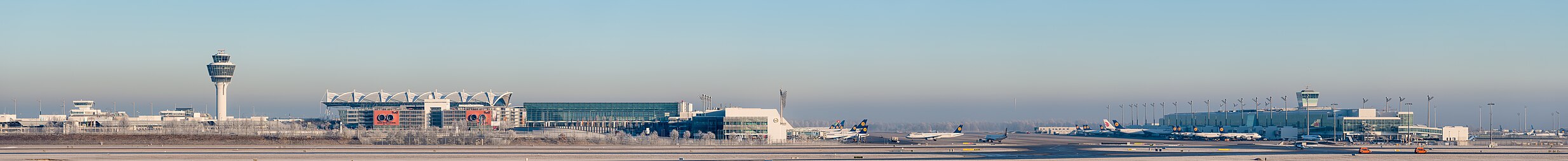 English: Munich Airport (IATA: MUC; ICAO: EDDM) Terminal 2 and Tower in February 2015. Deutsch: Der Flughafen München (IATA: MUC; ICAO: EDDM) Terminal 2 und Tower im Februar 2015.