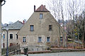 Former mill, later a residential building in open development