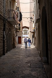 Old couple on a Bari street, Italy