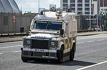 A Land Rover Defender-based OVIK Pangolin of the Police Service of Northern Ireland on patrol in Belfast PSNI Land Rovers, Belfast (geograph 7467837) (cropped).jpg