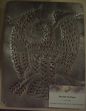 Detail of a tin panel from a pie safe at the American Eagle Exhibit held at Taylor University Pie Safe Tin Panel.JPG