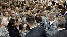 Secret Service agents to guard President George W. Bush in 2008. President George W. Bush greets troops guarded by Secret Service.jpg