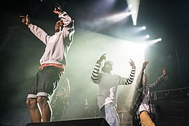 Pro Era Members Nyck Caution, Kirk Knight, and Joey Bada$$ alongside rapper A$AP Rocky at the Under the Influence Tour show in Toronto Canada (August 10, 2013).jpg